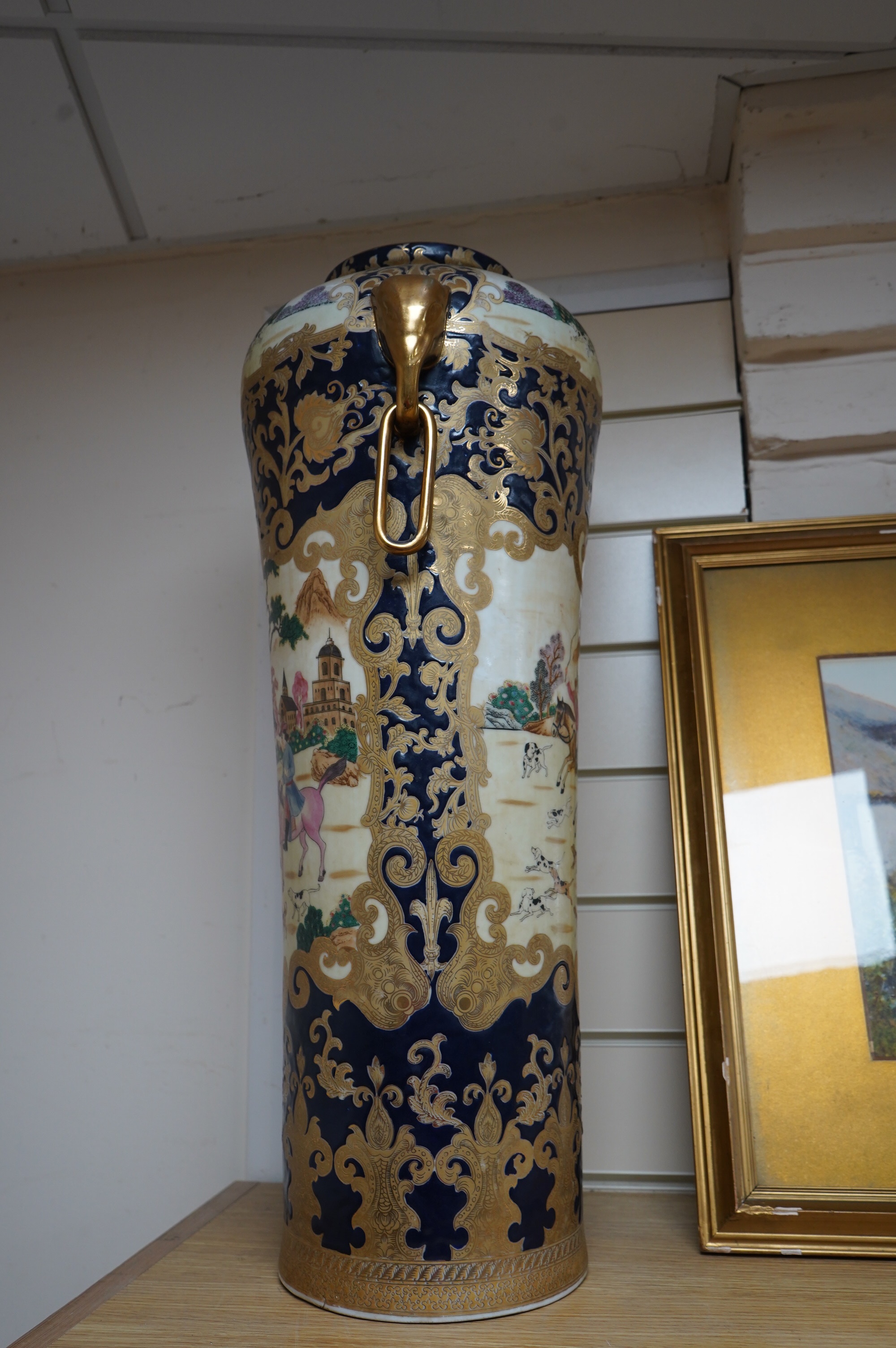 A 20th century Chinese vase decorated with figures on horseback, 63cm high. Condition - good